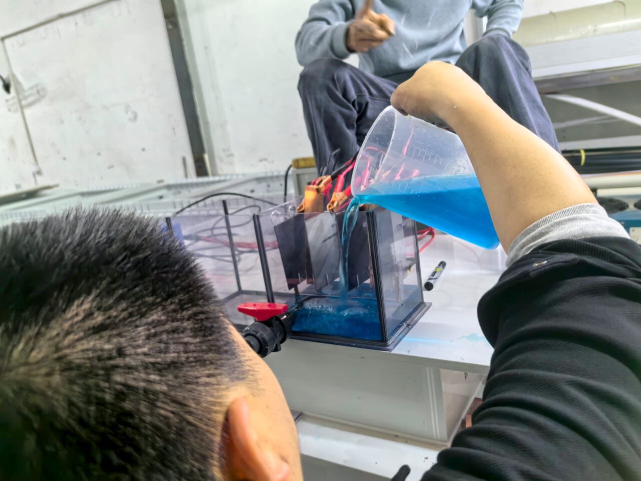 Pregnant leach solution being processed at Xincheng's pilot cell